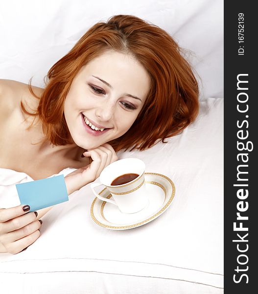 Woman Lying In The Bed Near Cup Of Coffee.