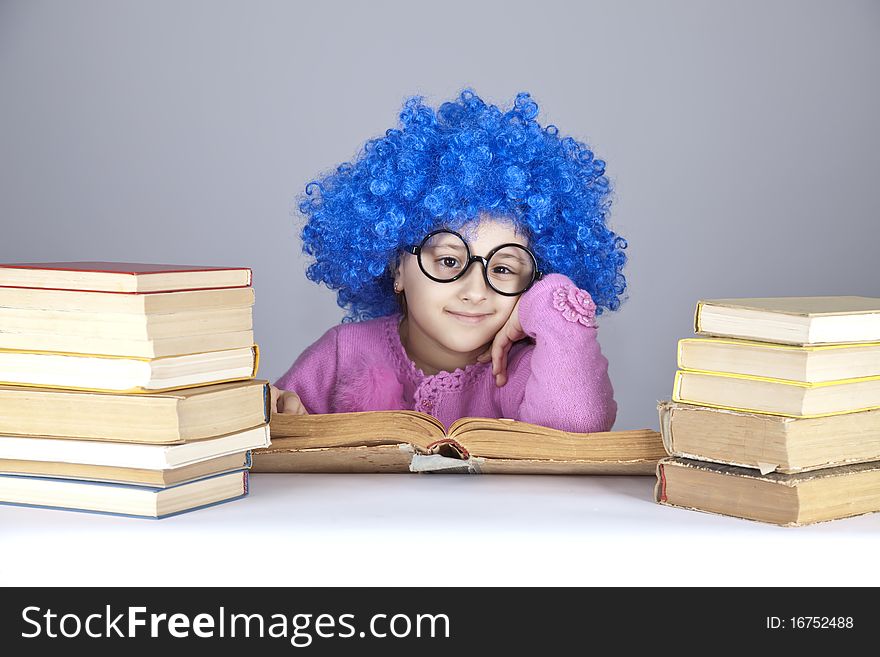 Young blue-haired girl with books. Studio shot.