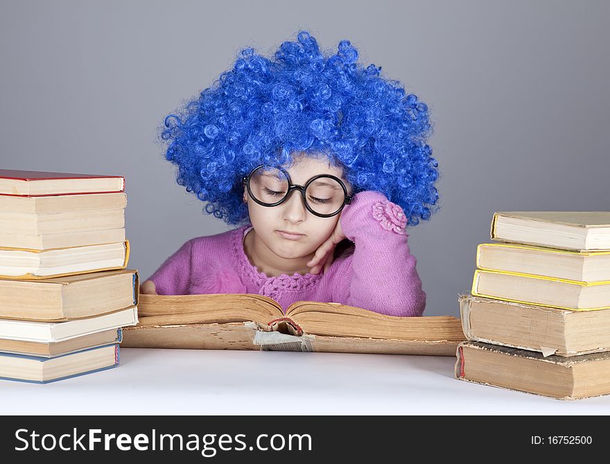 Young blue-haired girl with books.