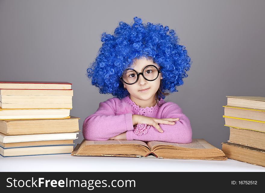 Young blue-haired girl with books.