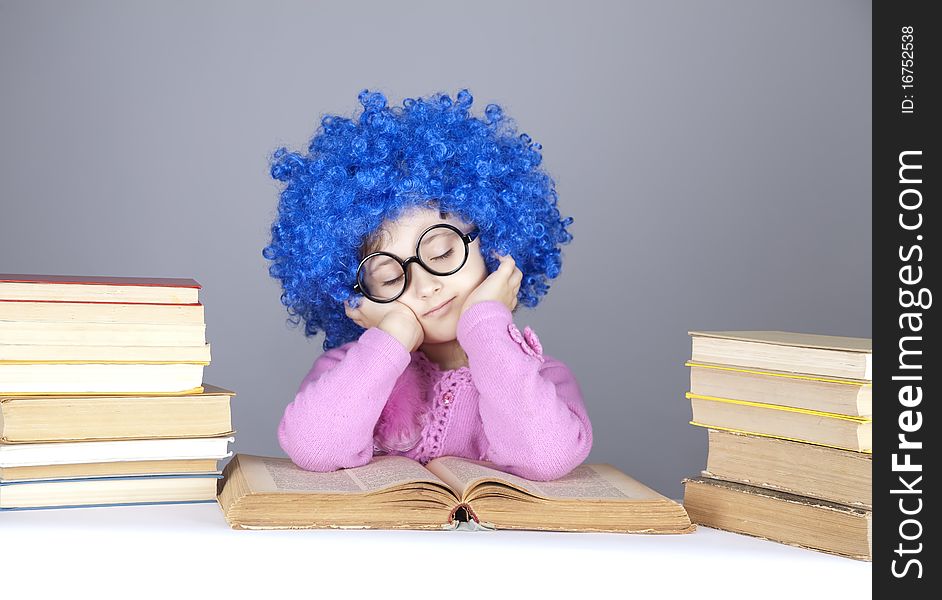 Young blue-haired girl with books. Studio shot.