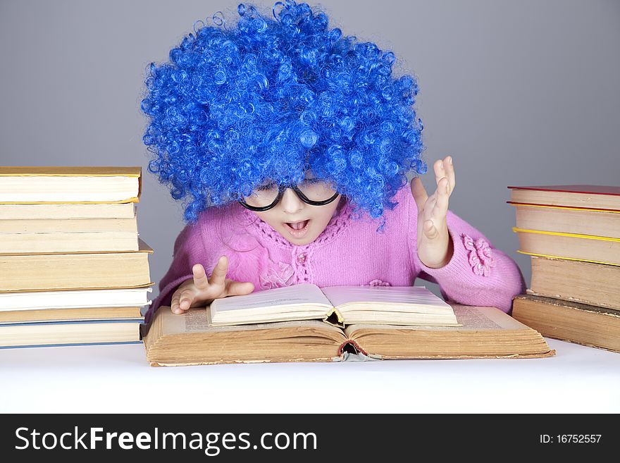 Young blue-haired girl with books.