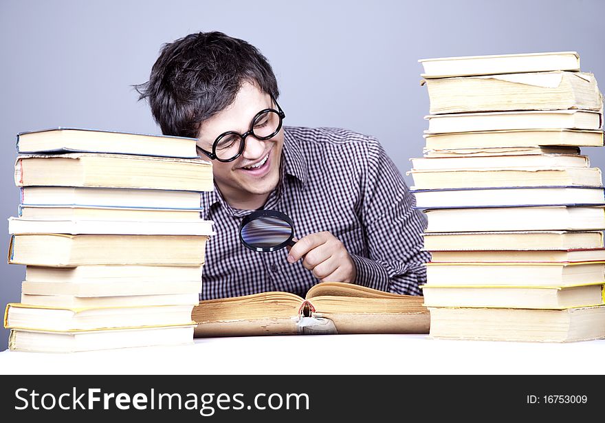 The young student with the books isolated. Studio shot.