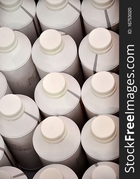 White plastic bottle for storaging industrial material or liquid.