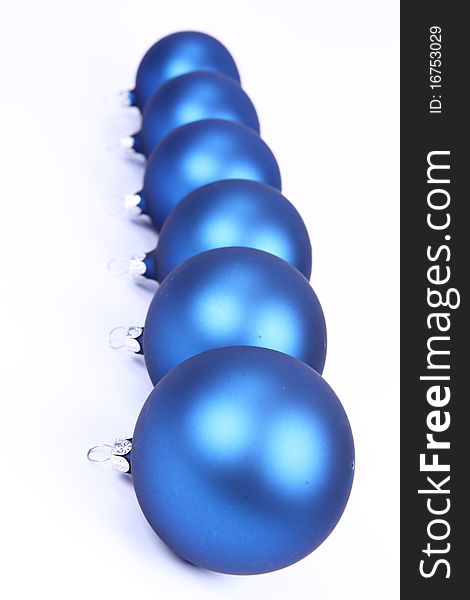Blue matt christmas balls on white background, with space for your text