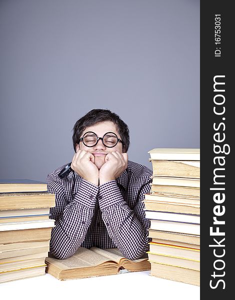 The young student with the books isolated. Studio shot.