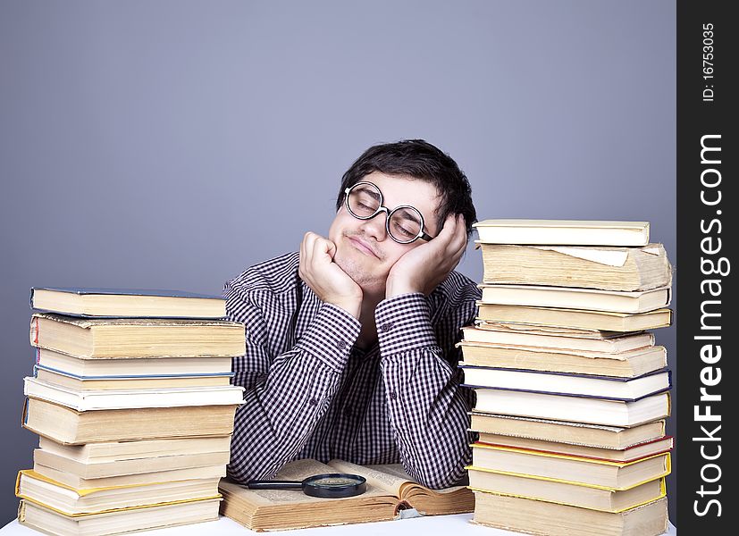 The young student with the books isolated. Studio shot.