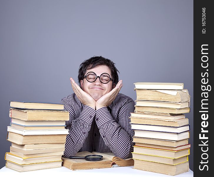 The young student with the books isolated. Studio shot.