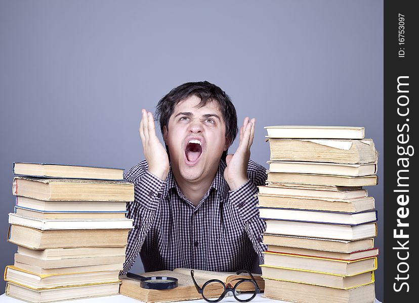 The young student with the books isolated. Studio shot.