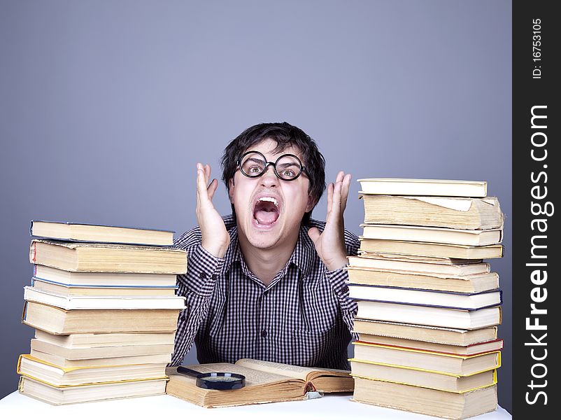 The young student with the books isolated. Studio shot.