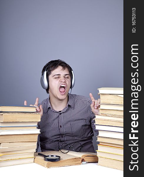 The young student with the books isolated. Studio shot.