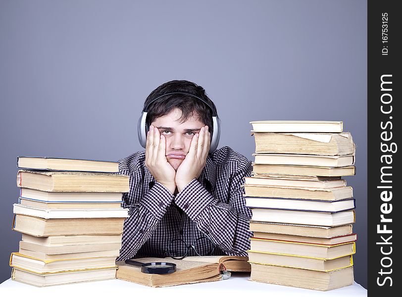 Student with the books and headphone isolated.