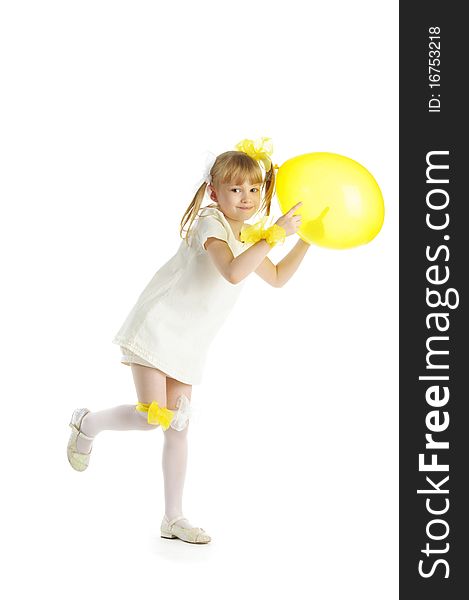 Girl with yellow balloon isolated in white