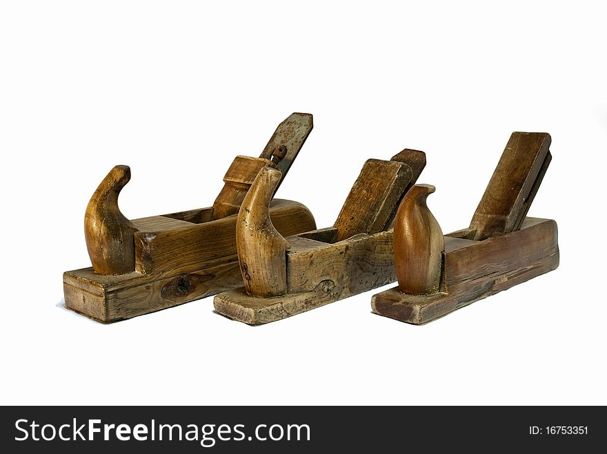 Three isolated and old jack planes on a white background