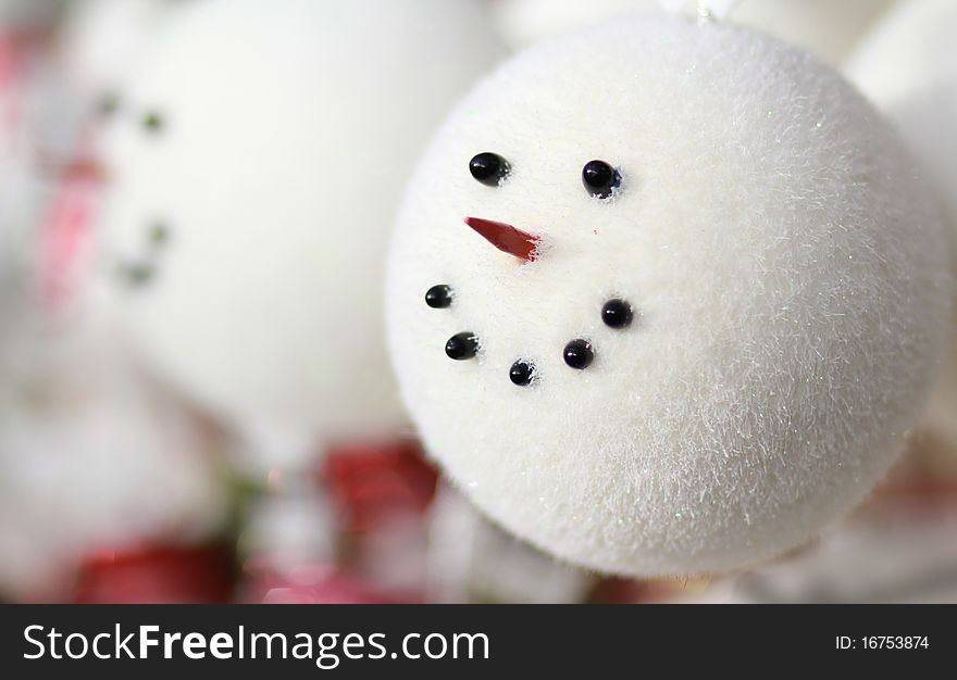 Cute smiling snowman face holiday ornament. Cute smiling snowman face holiday ornament