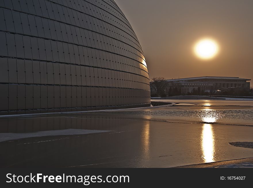 Sunrise, the National Grand Theater in Beijing, China film, when it is winter, a layer of water ice. Sunrise, the National Grand Theater in Beijing, China film, when it is winter, a layer of water ice.