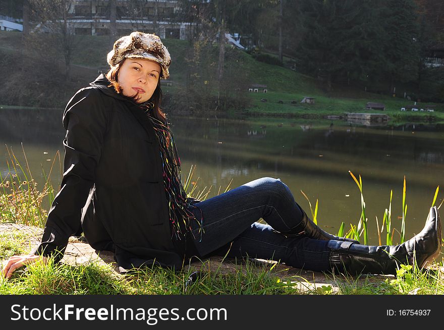 Girl In The Autumn Park Near The Lake