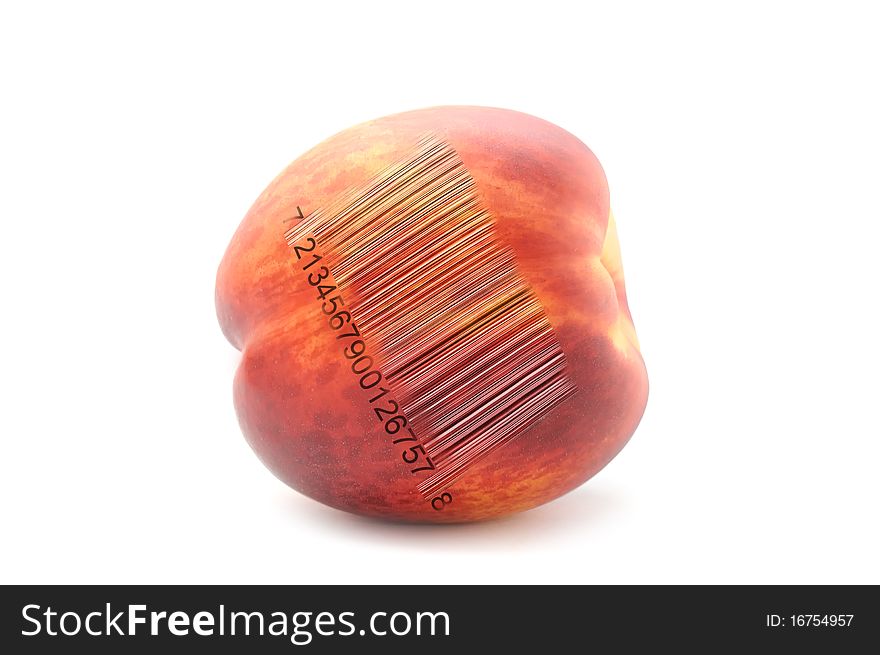 A peach with a bar code isolated on a white background. A peach with a bar code isolated on a white background