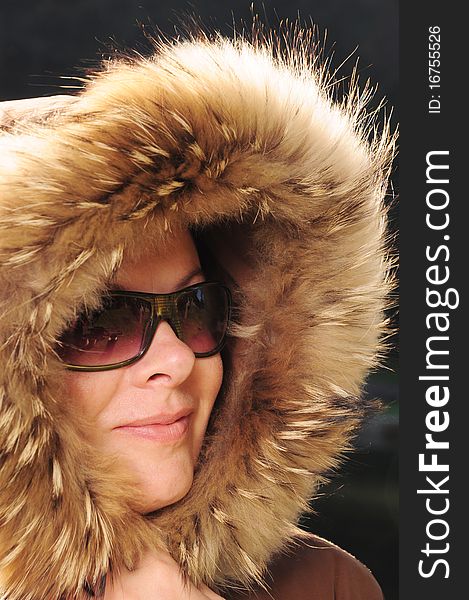 Beautiful woman in winter fur coat