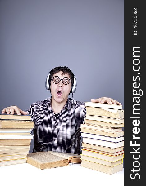 Student with the books and headphone isolated.