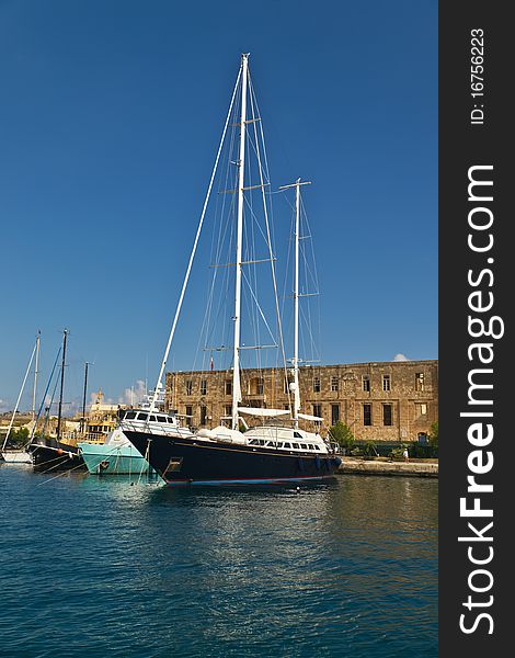 Luxury private yacht docking in the harbour