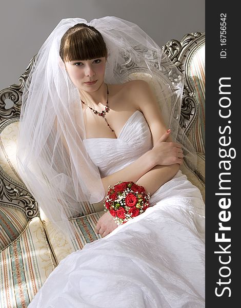 Bride sitting in luxury interior