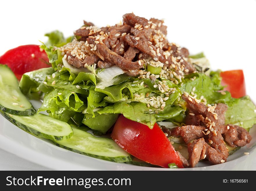 Macro shot of sesame beef with vegetables