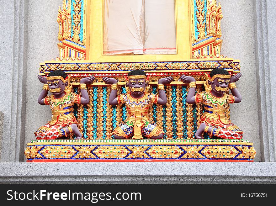 Three giant carry Buddha church window in temple.