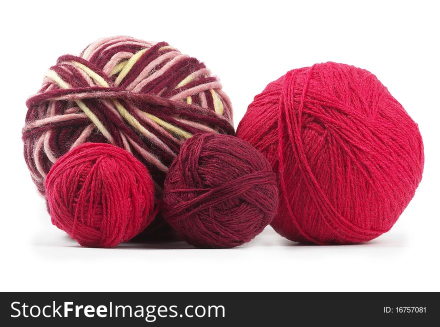 Four colored wool clews