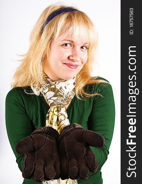 Blond girl with brown warm gloves. Blond girl with brown warm gloves