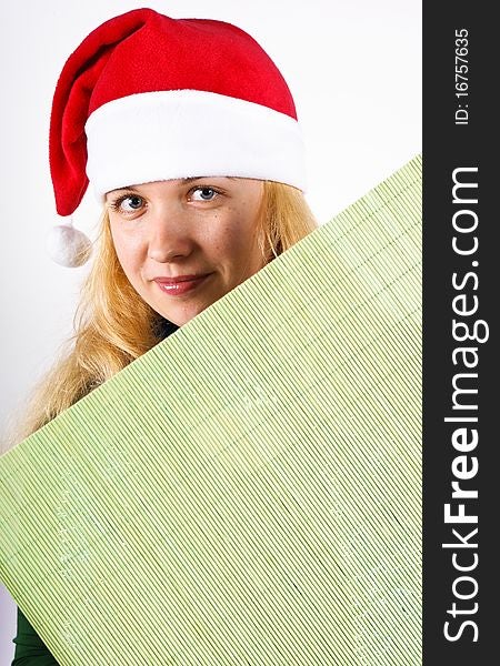 Girl holding green board over a white background