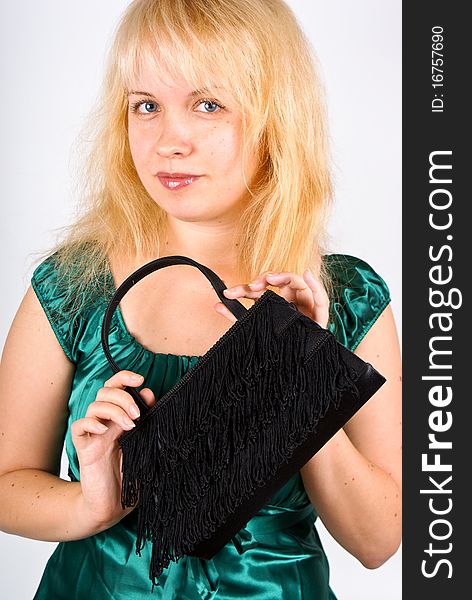 Young woman with clutch bag