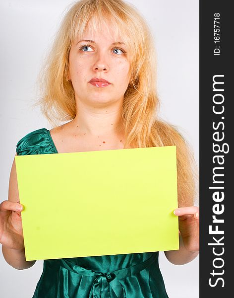 Blond woman holding a blank message paper