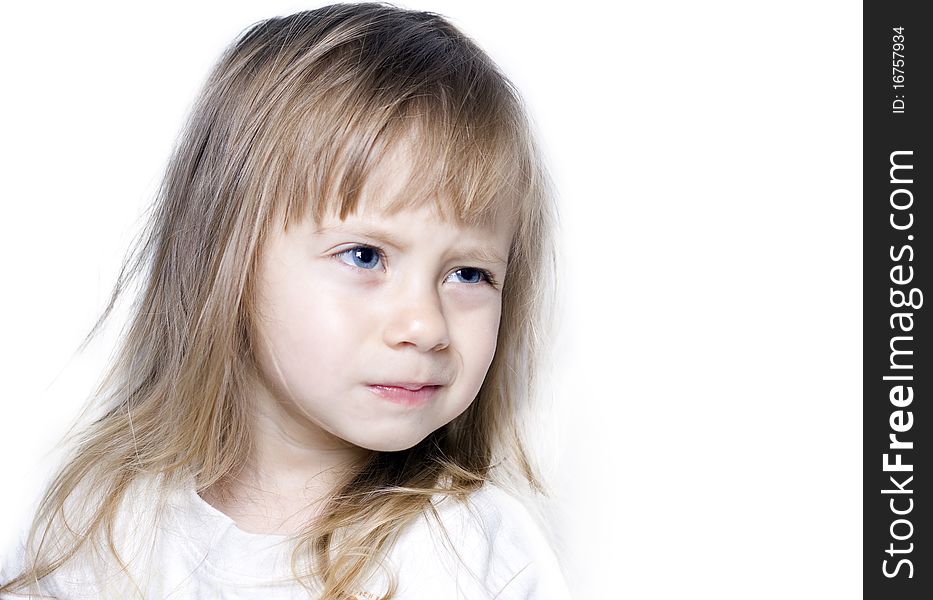 Cute young girl with a mischievous look on his face isolated on a white background. Cute young girl with a mischievous look on his face isolated on a white background