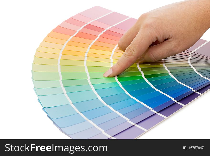 Woman hand pointing to a sample color chart close up