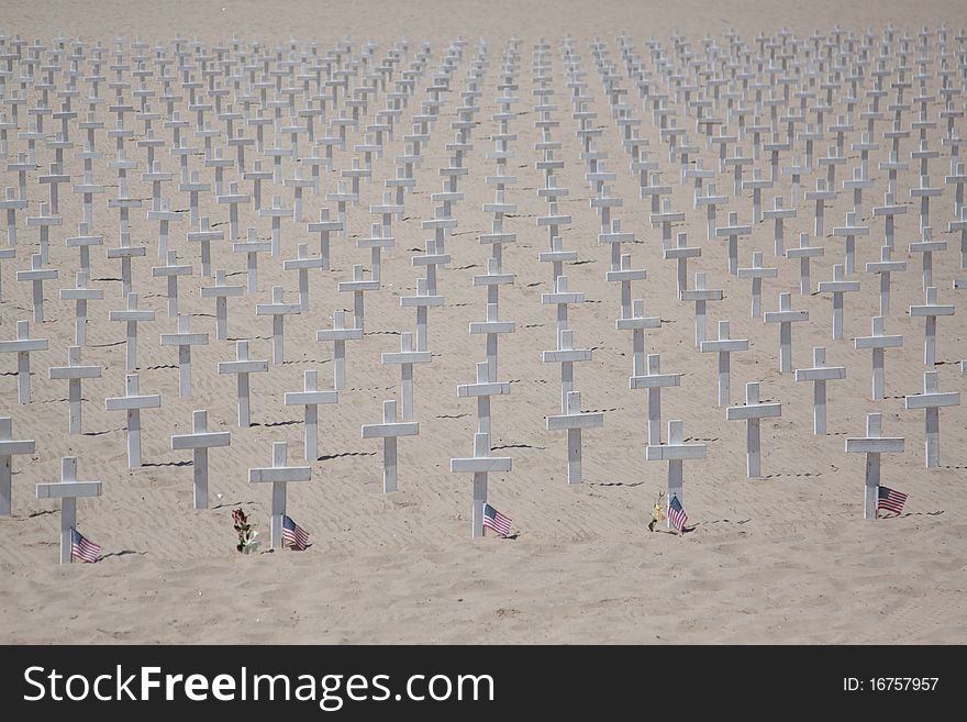 Wooden crosses in memory of fallen soldiers at war - Santa Barbara beach
