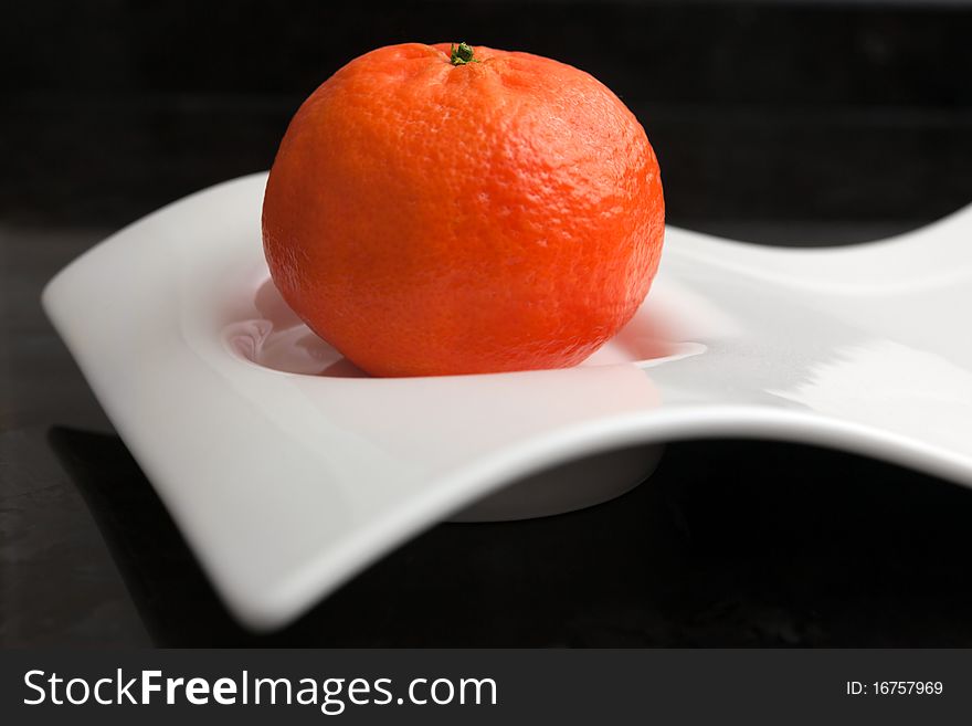 Tangerine On A Original White Plate.