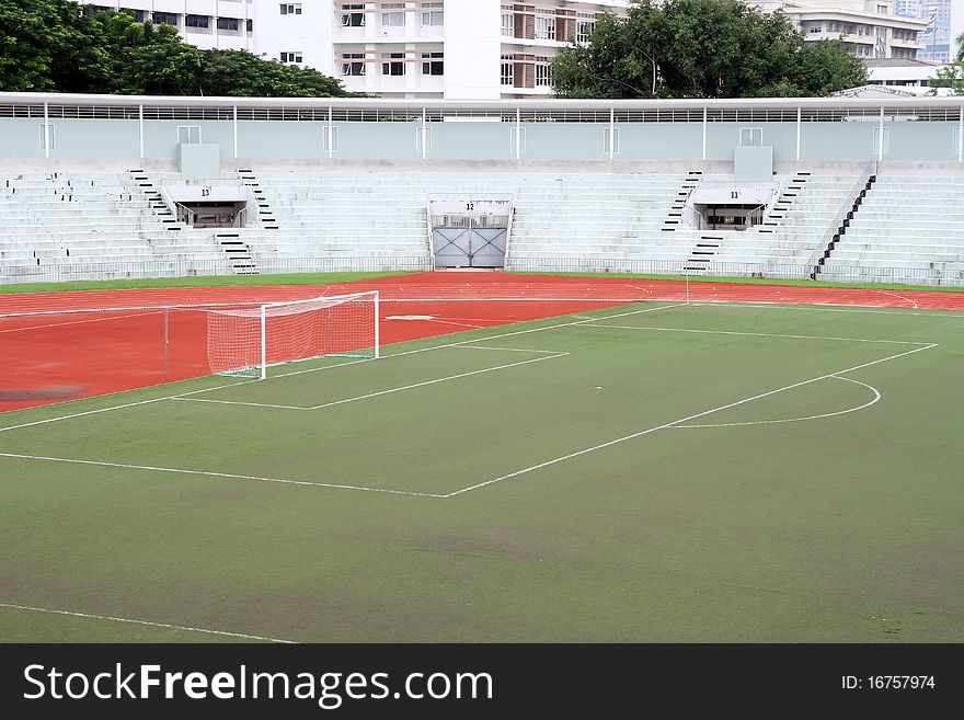 Soccer football goal with penalty area on fake grass pitch