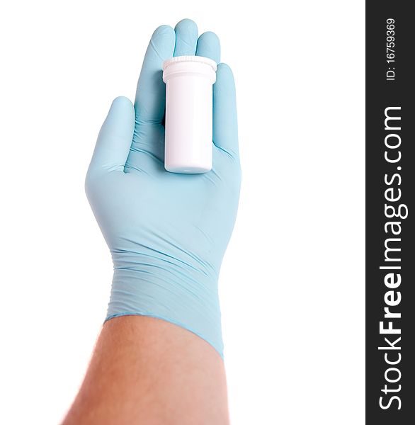 Doctor in blue gloves holding pills
