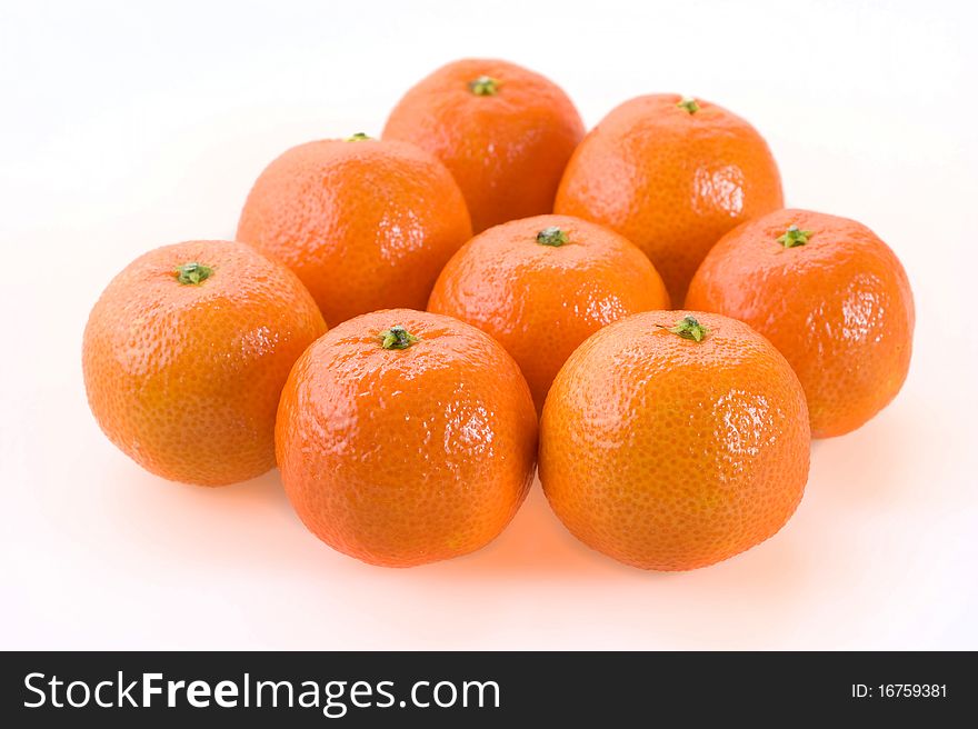 Sweet bright mandarins on a white background closeup