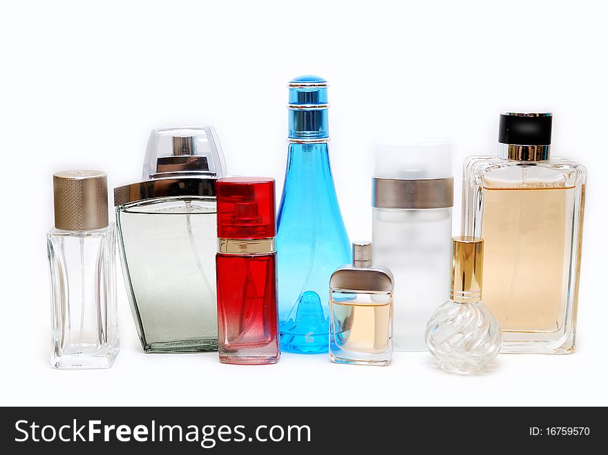 Eight bottles of perfume isolated on white background