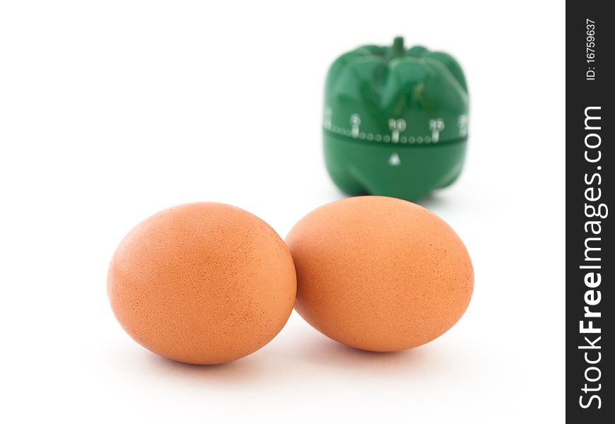 Concept of boiling eggs with eggs and green timer on white background