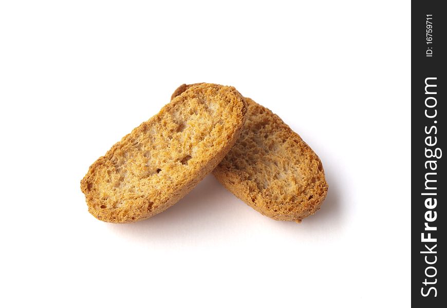 Two pieces of dry bread on a white background
