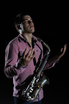 Young Handsome Man Playing Music On Saxophone Stock Photos Young Handsome Man Playing Music On Saxophone Stock Photos