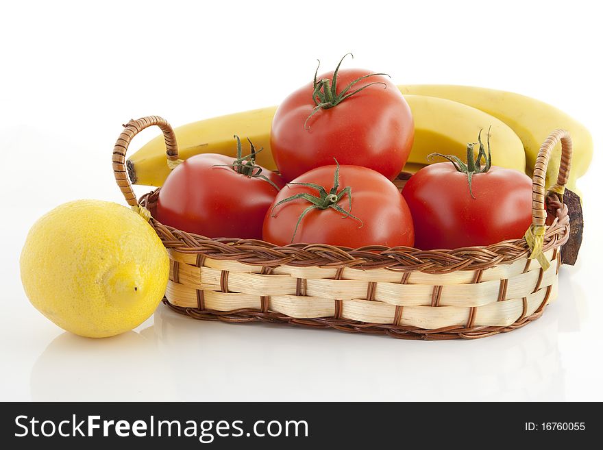 Ripe fruits and vegetables against the white background