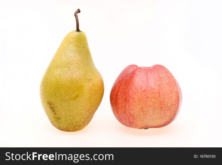 Fresh ripe apple and pear close-up on a white background. Fresh ripe apple and pear close-up on a white background