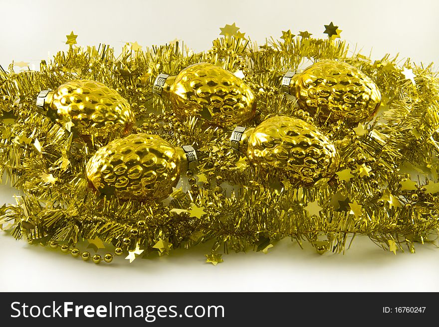 Golden garland and cones for New Year's tree. Golden garland and cones for New Year's tree