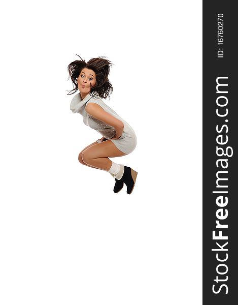 Dynamic beautiful wild winter woman jumping and screaming. isolated on white background. Dynamic beautiful wild winter woman jumping and screaming. isolated on white background