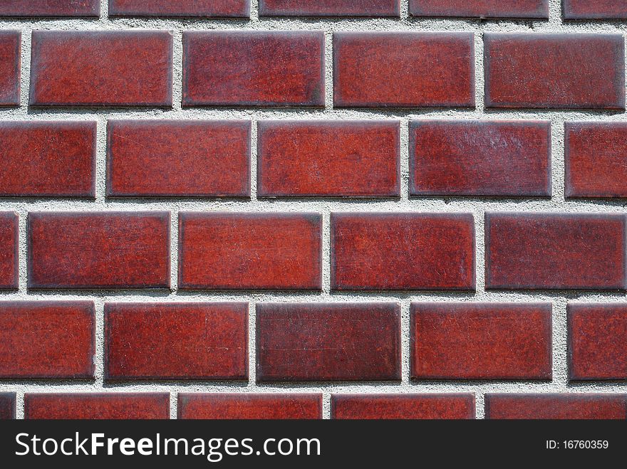 Highly-detailed dark-crimson tiled wall background