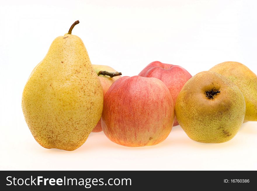 Fresh ripe apples and pears close-up on a white background. Fresh ripe apples and pears close-up on a white background
